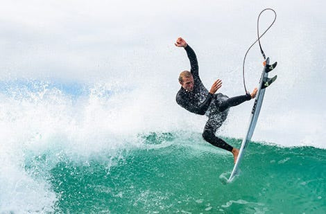 Pro surfer making an aerial