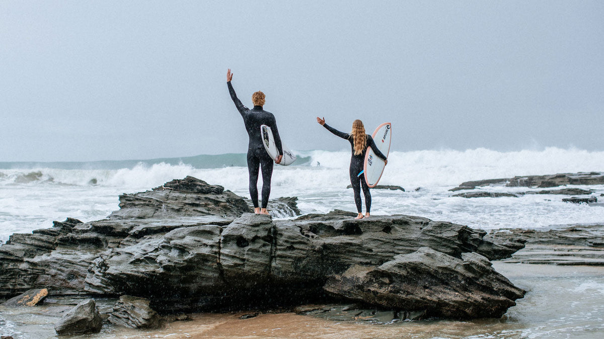 Korbin and Jamaica standing on a rock in Anglesea