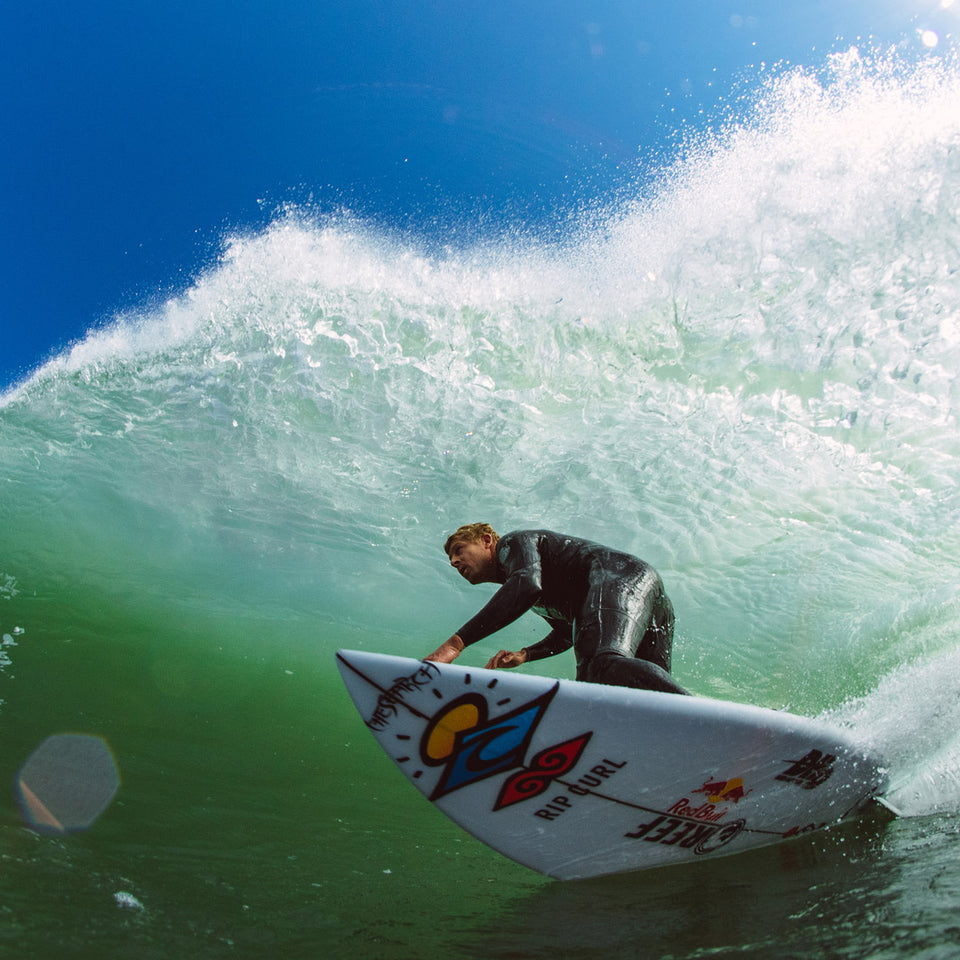Mick Fanning surfing in a Rip Curl wetsuit