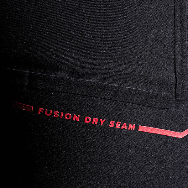 Black fabric with red 'Fusion Dry Seam' text on a close-up of clothing.