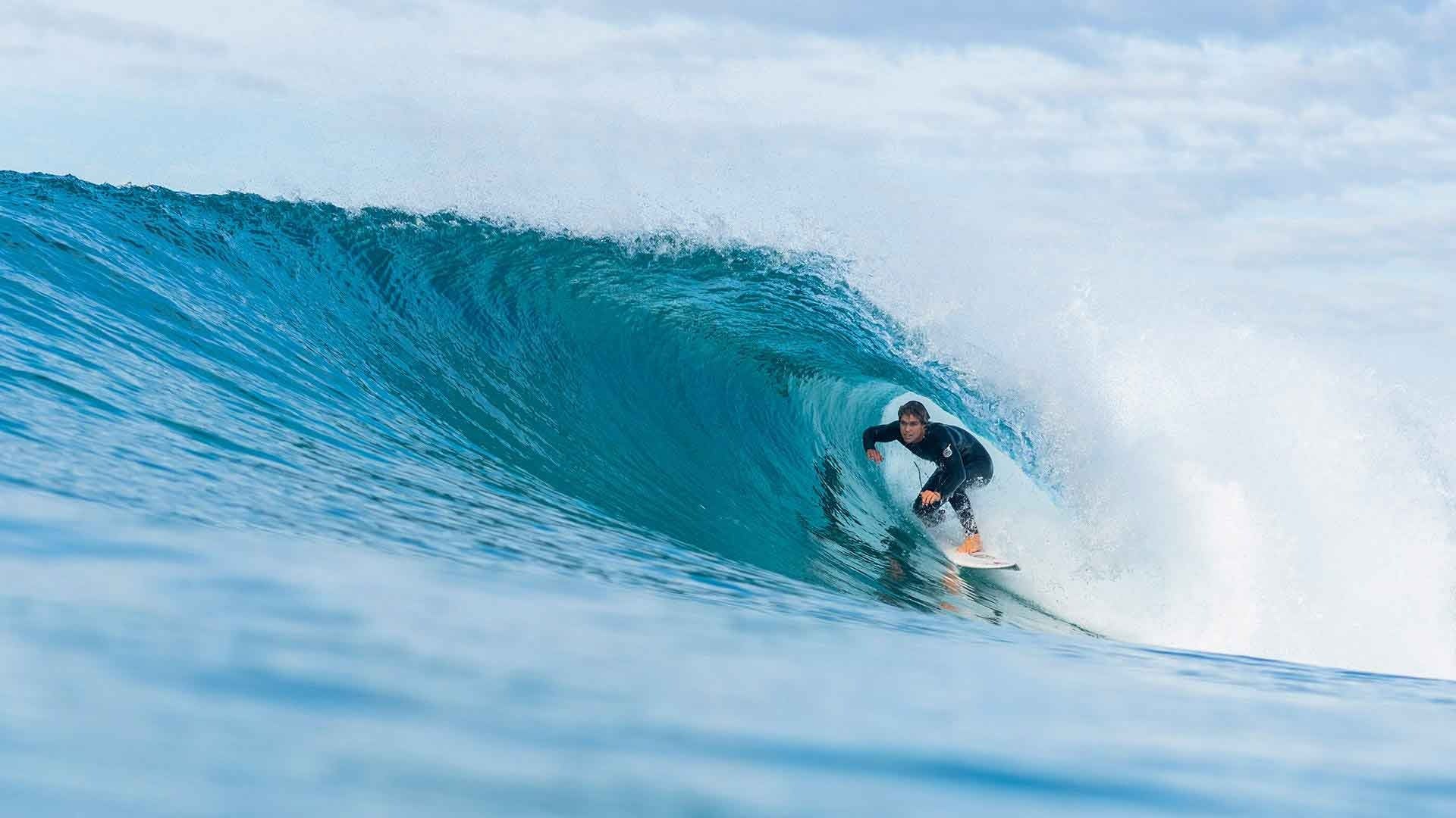 Surfer riding a wave in the ocean
