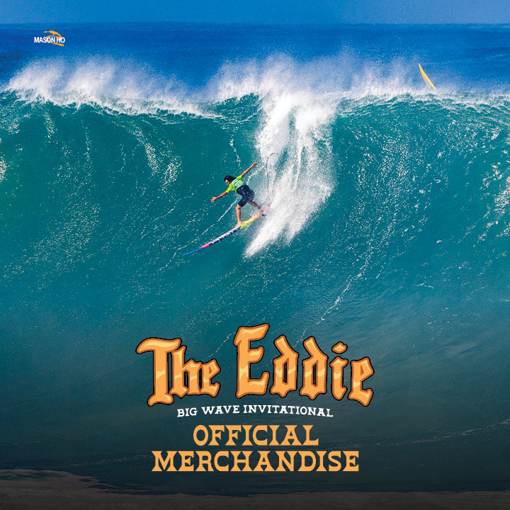 Surfer riding a large wave with 'The Eddie Big Wave Invitational' branding.
