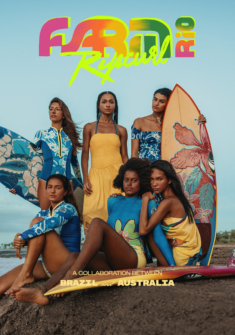 A beach-themed promotional graphic with five women wearing colorful Brazil and Australia surfwear, posed with surfboards on sand under a large rainbow 'FABRA Rio' logo and the text 'A collaboration between BRAZIL and AUSTRALIA.' Because people and a real beach environment are present, this is Lifestyle rather than Product/Packaging.