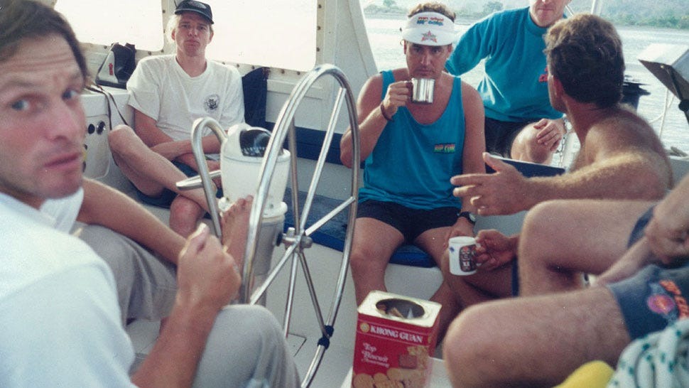 Group of people on a boat, enjoying a sunny day out.