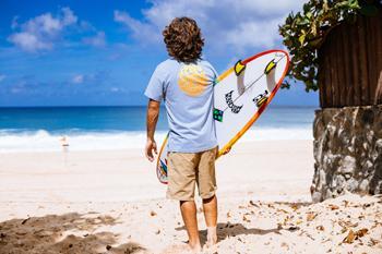 Mason Ho wearing a blue Icons Of Surf t-shirt