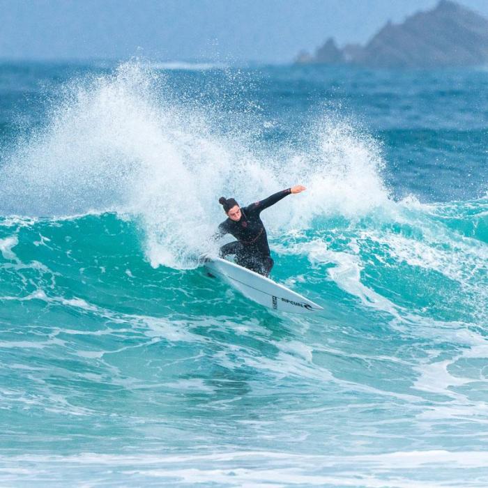 Tyler Wright surfing in the Flashbomb Fusion Wetsuit