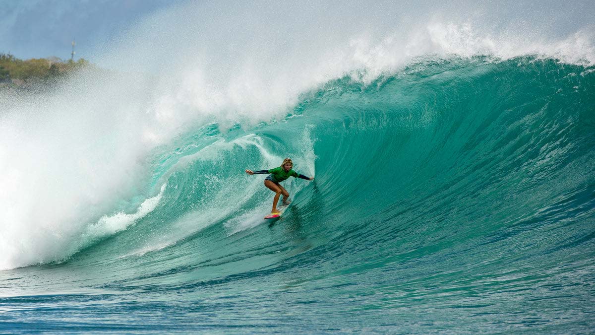 Rip Curl surfer Erin Brooks surfing a barrel wave in Padang Padang