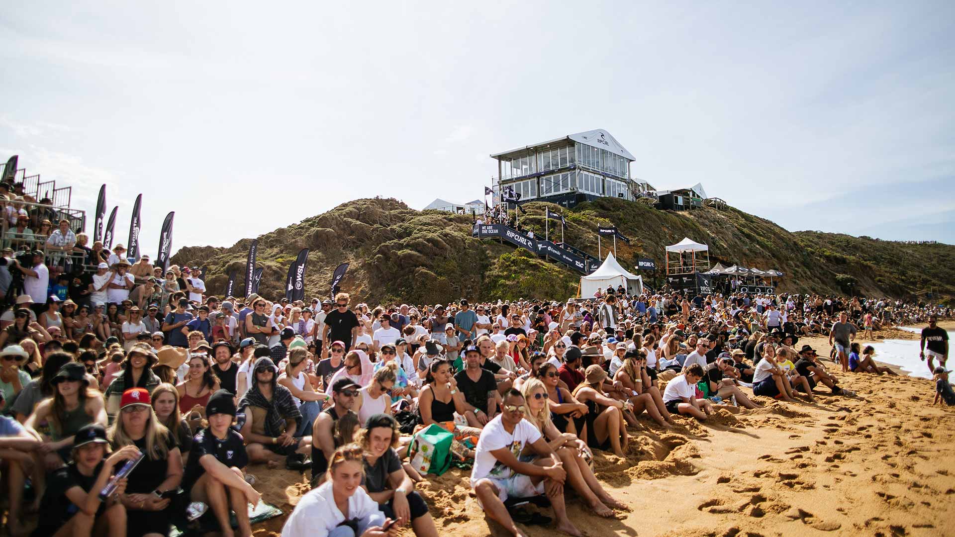 Crowd Sitting On Bells Beach