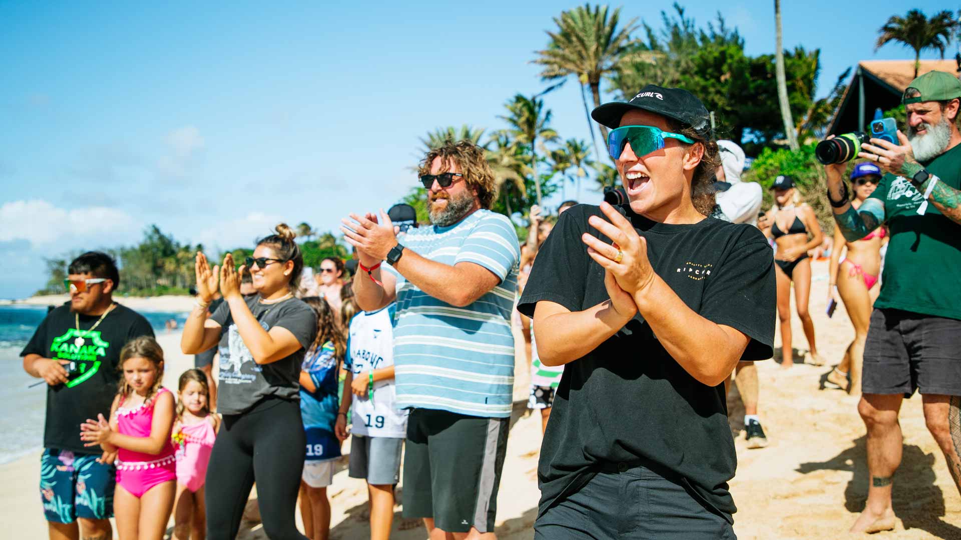 Brisa Hennessy and Tyler Wright cheering on Molly Picklum.