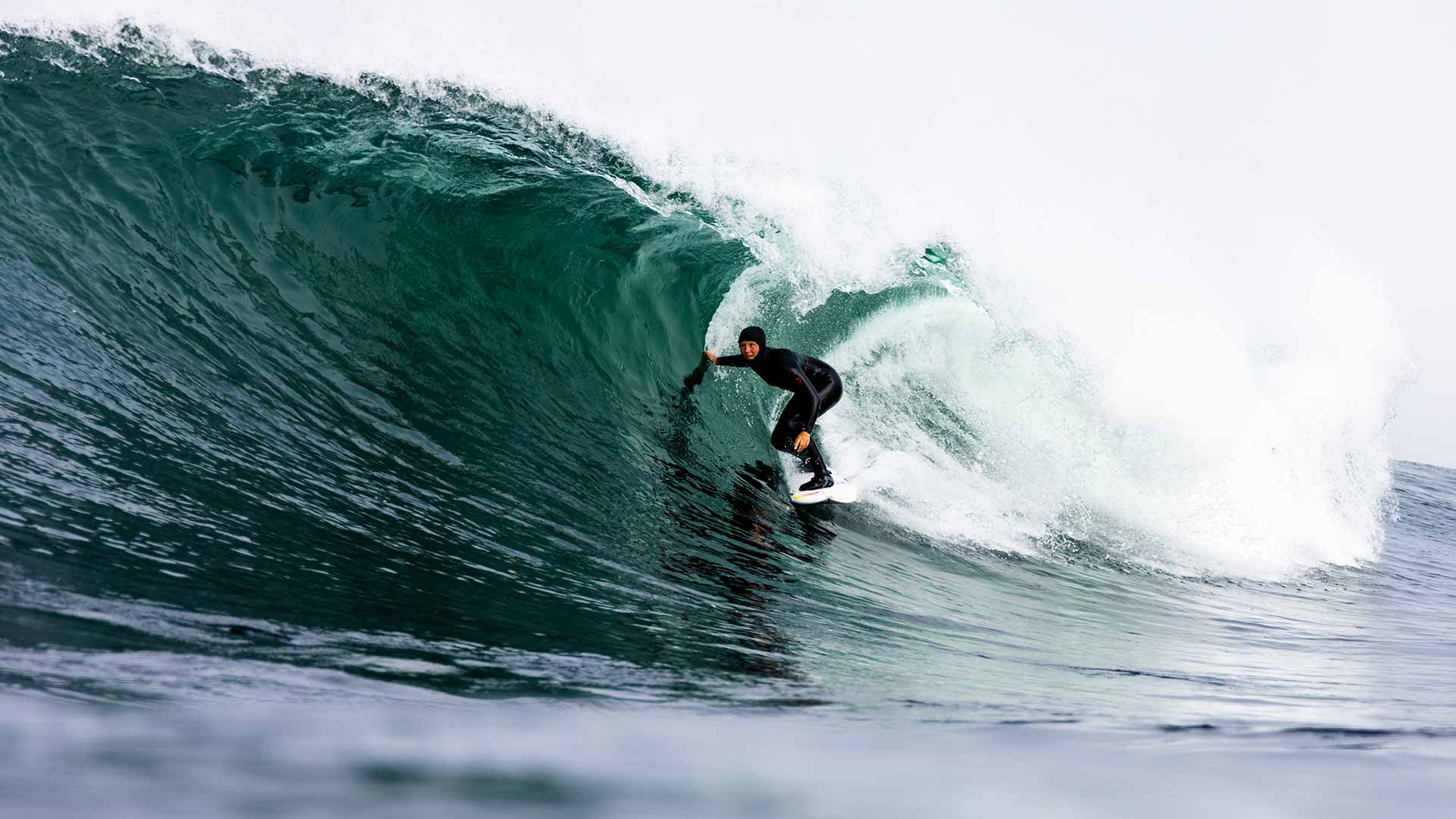 Mathea Olin catching waves in the Rip Curl winter wetsuit in Canada.