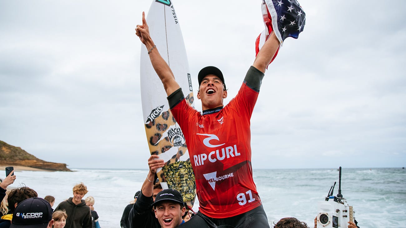 Cole Houshmand being chaired across the beach after his win