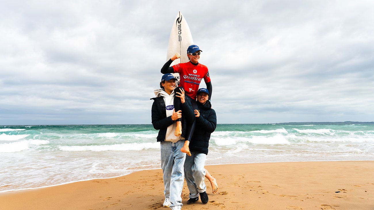 GromSearch winner getting chaired up the beach by friends