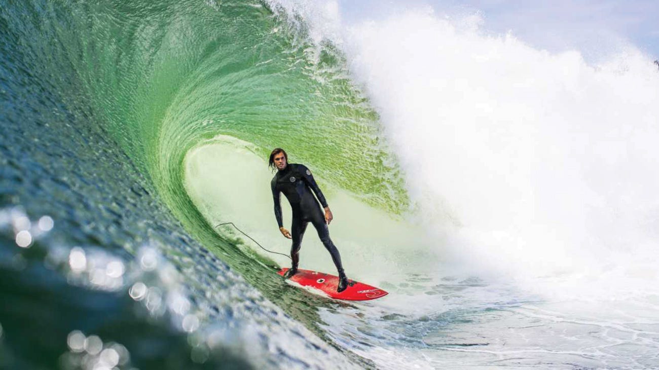 Kipp Caddy surfing in the Flashbomb Heatseeker Wetsuit