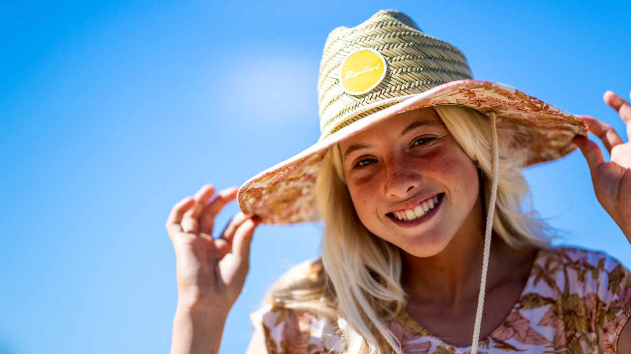 Close up portrait of Erin Brooks wearing the Paradise Straw Hat.
