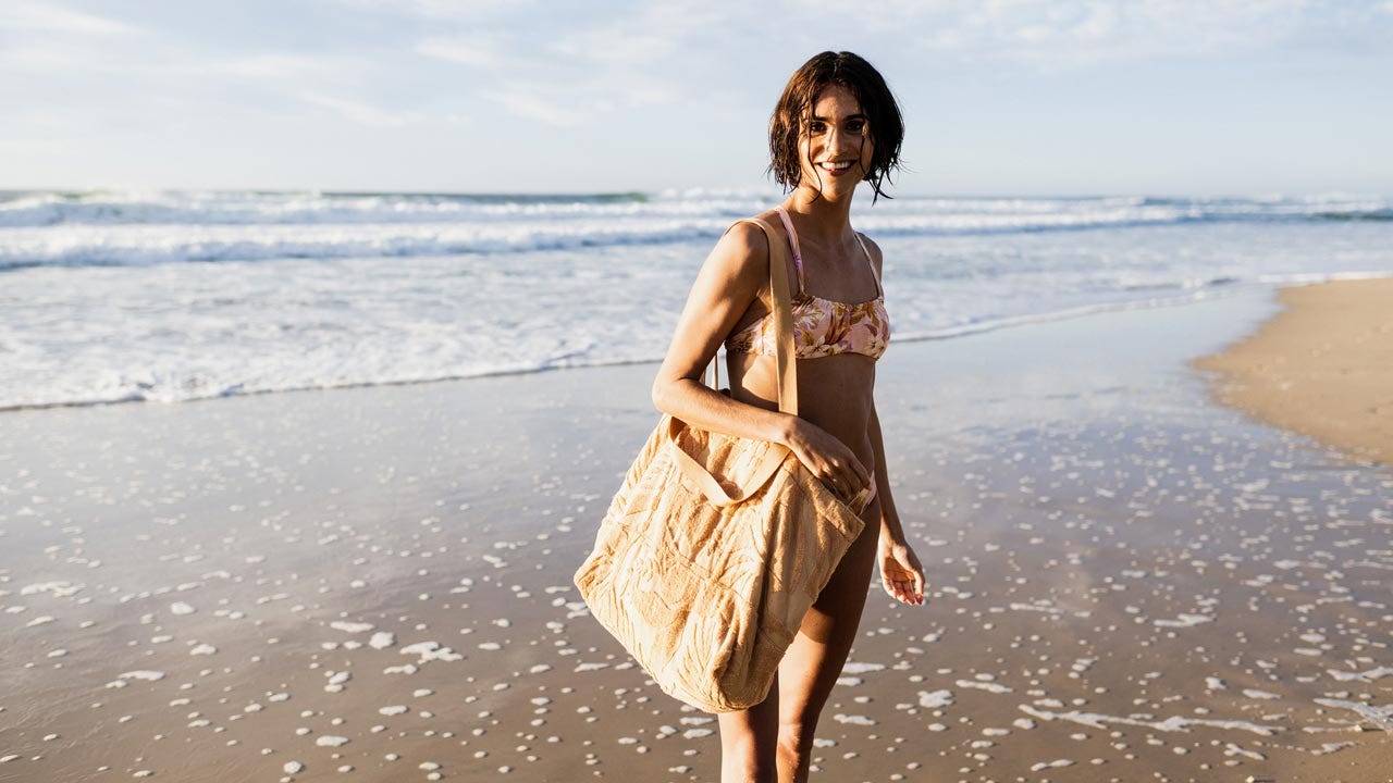 Victoria Vergara in Noosa carrying the Sun Ray Terry Toweling Tote
