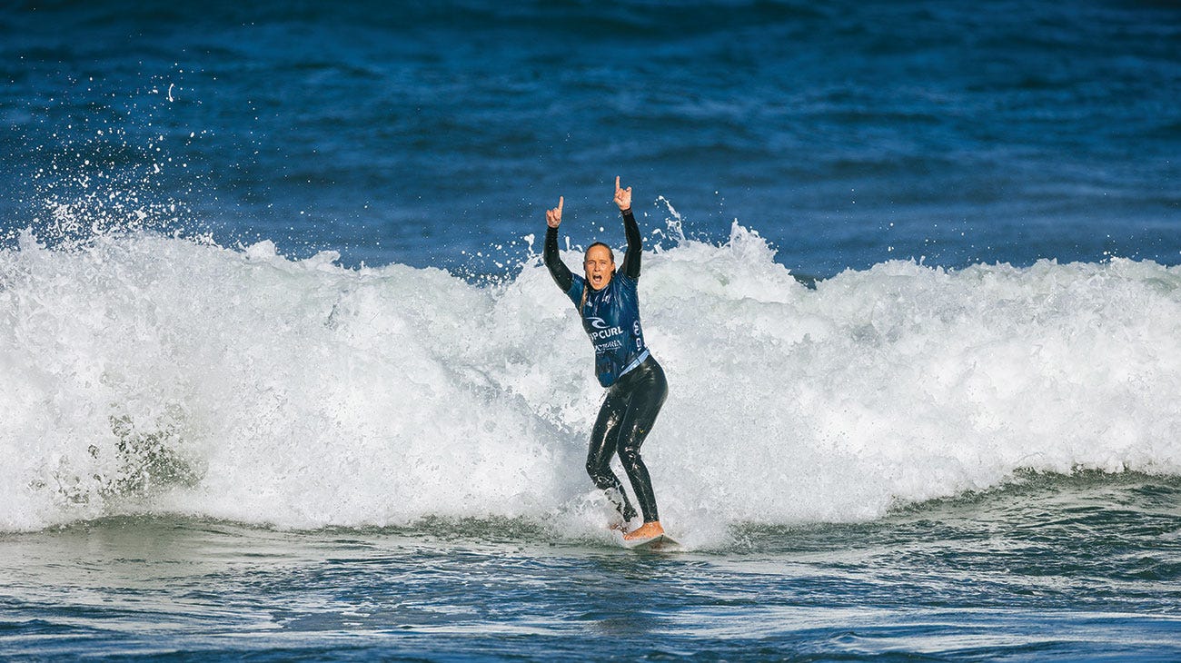 Isabella Nichols celebrating while surfing