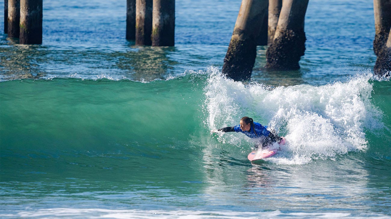 Victoria Feige surfing her heat in Huntington Beach, California