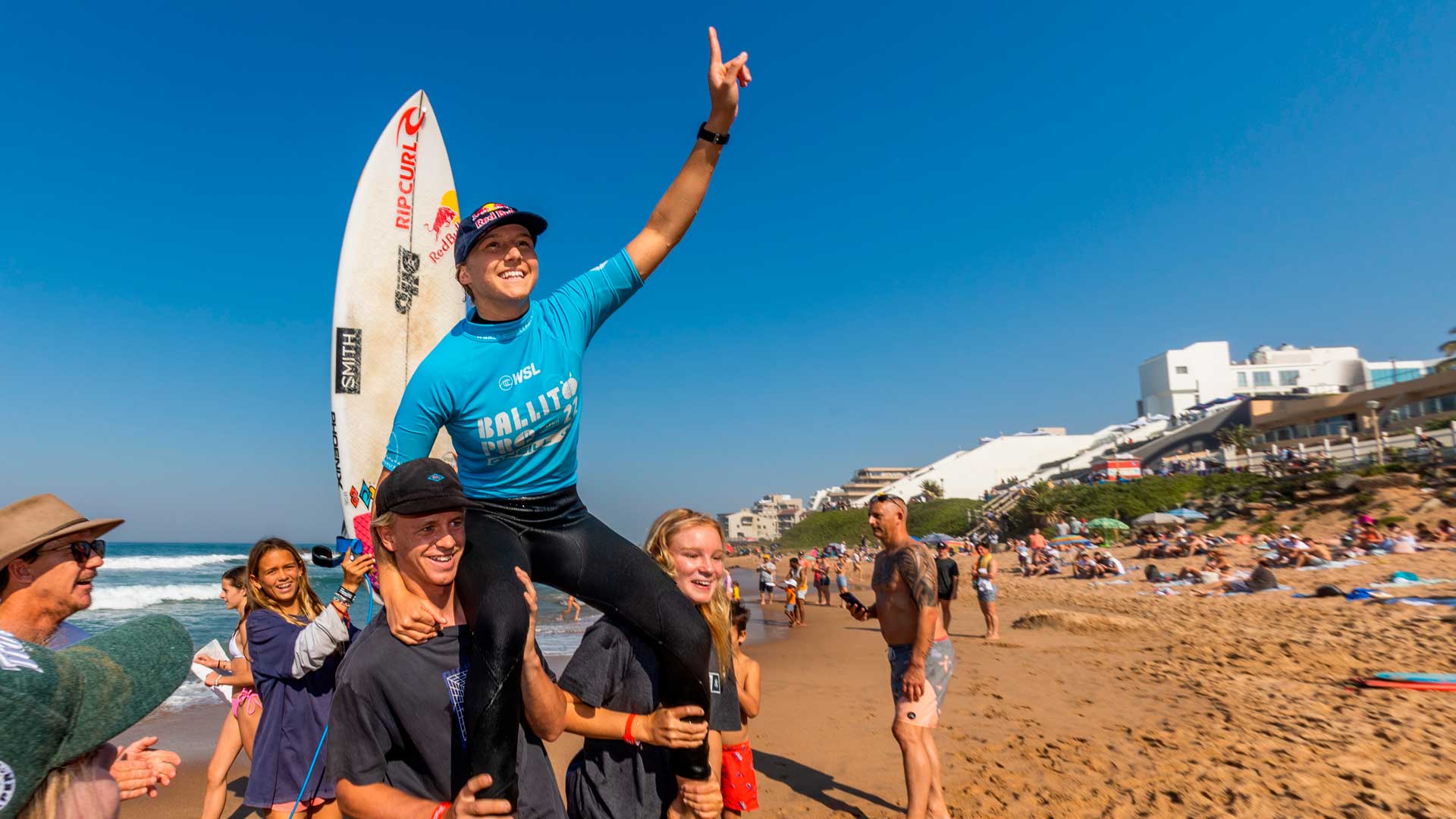 Molly Picklum being chaired across the beach after her win