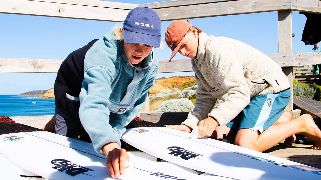 Groms waxing up their boards before the GromSearch comp