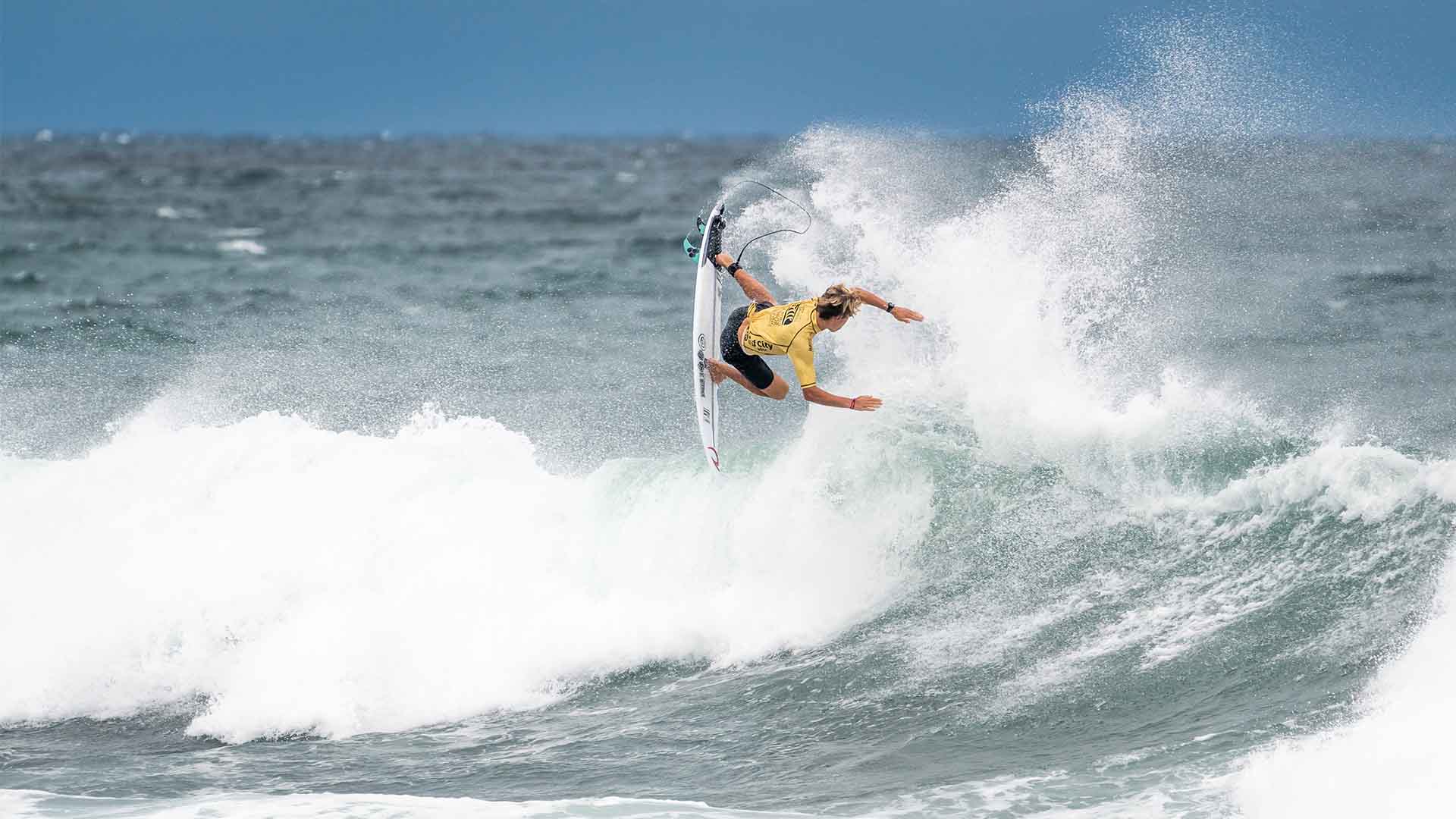 Luke Swanson surfing in her winning heat