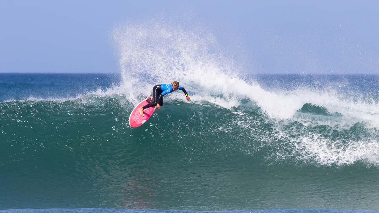 Mitchell Henderson surfing in his heat at the GromSearch event in Jan Juc