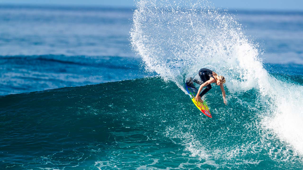 Teen prodigy Erin Brooks surfing at Pipeline, Northshore, Hawaii