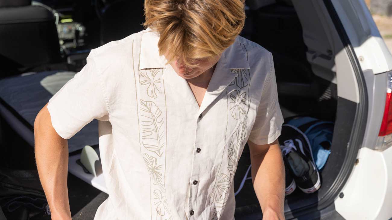 Mikey wears a Mod Tropics shirt