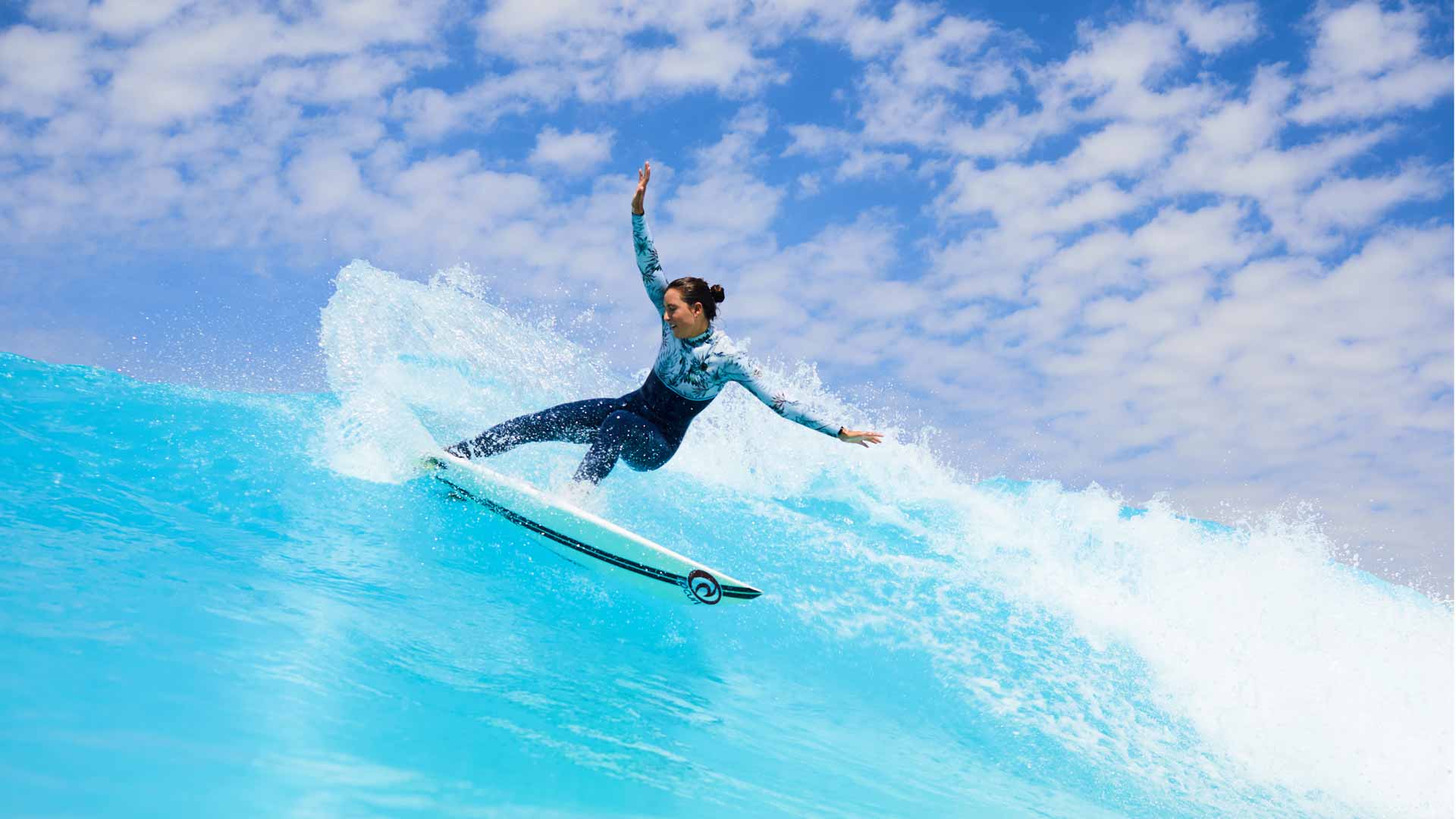 Tyler Wright carving a wave at URBN Surf, Melbourne