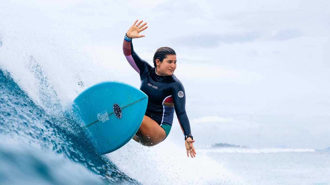 Brisa Hennessy surfing in Fiji