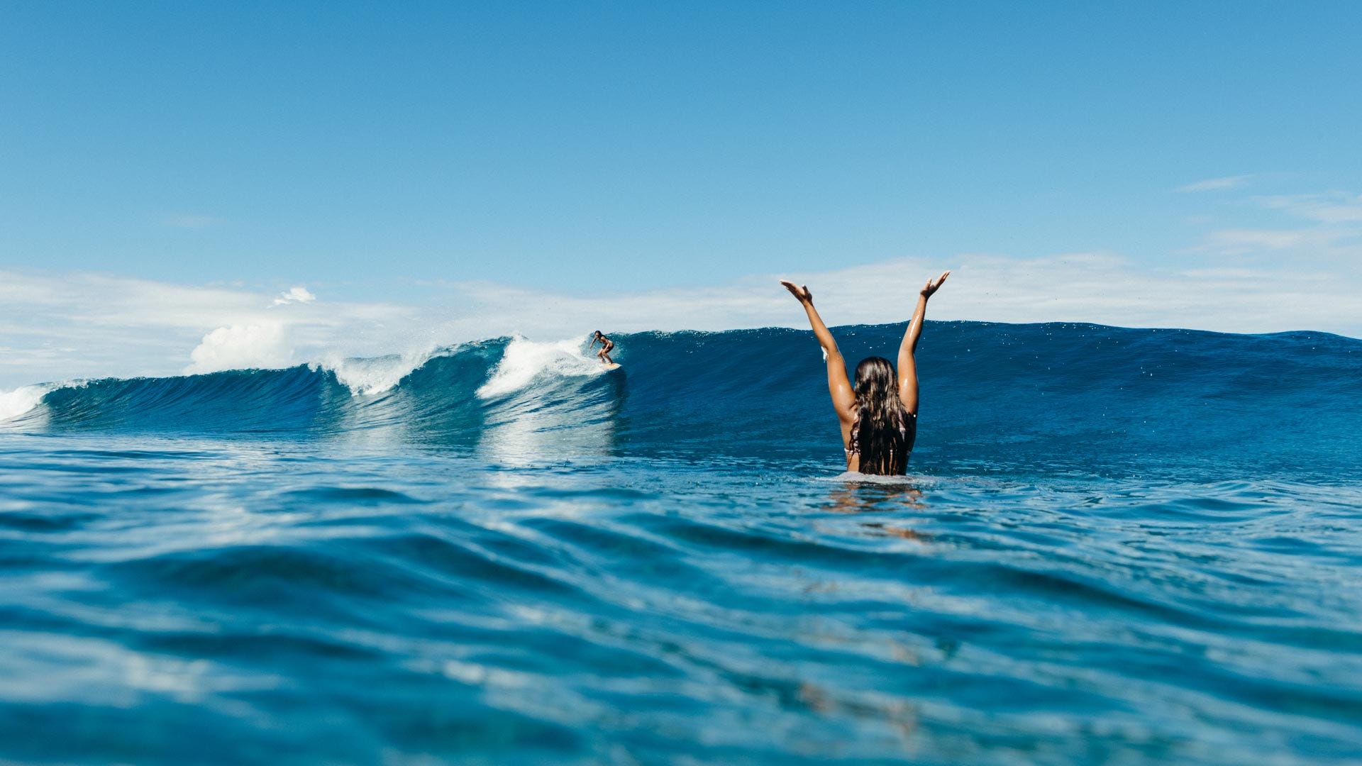 Rip Curl womens surfers celerating a wave in Krui, Indonesia.