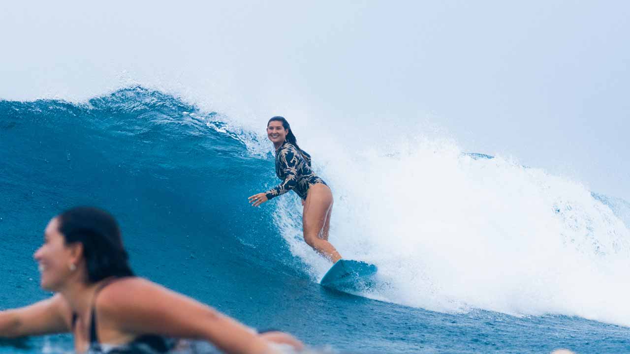 Brisa Hennessy surfing in Fiji