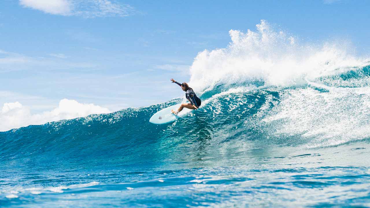 Brisa Hennessy surfing in Fiji