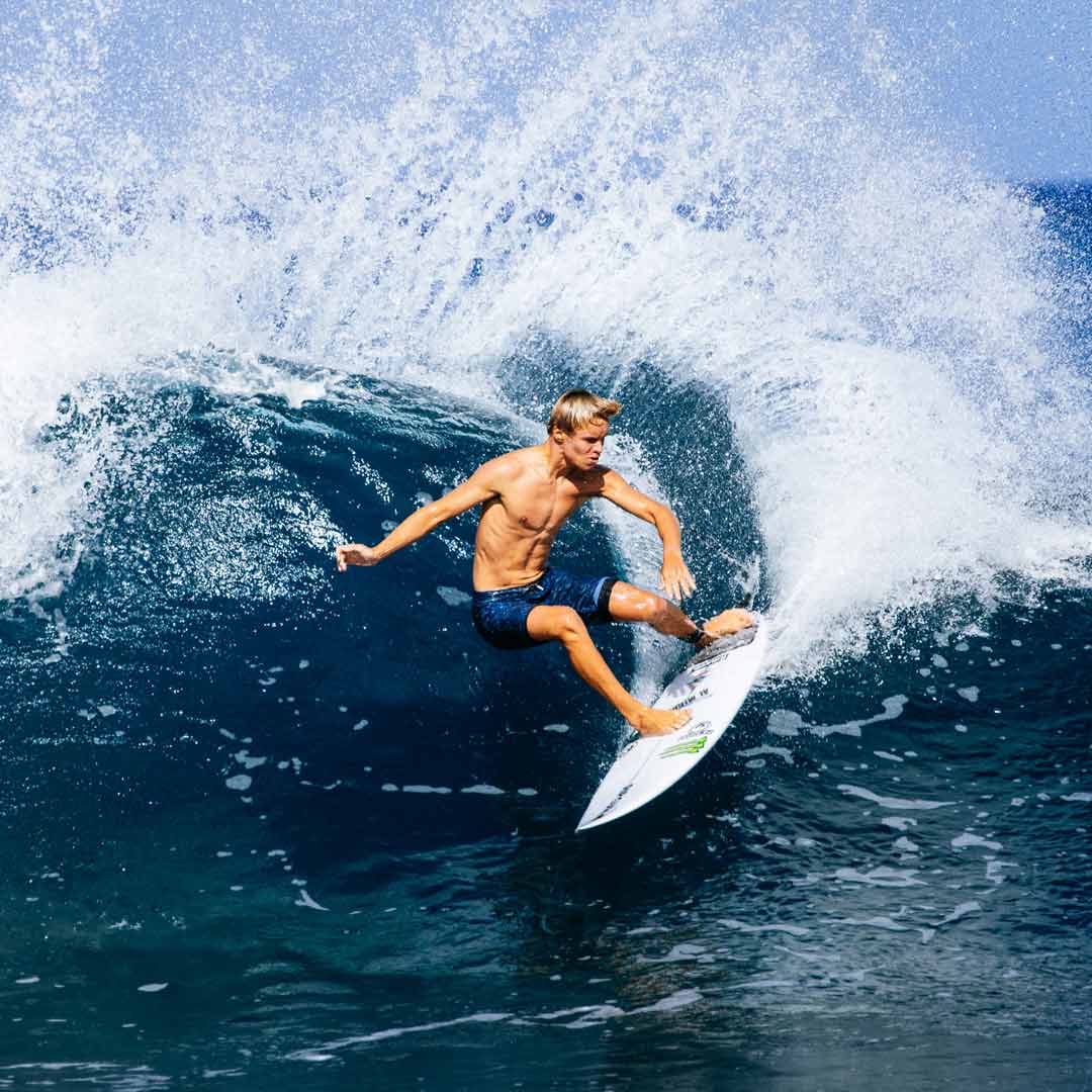 Luke Swanson carving a turn in Hawaii