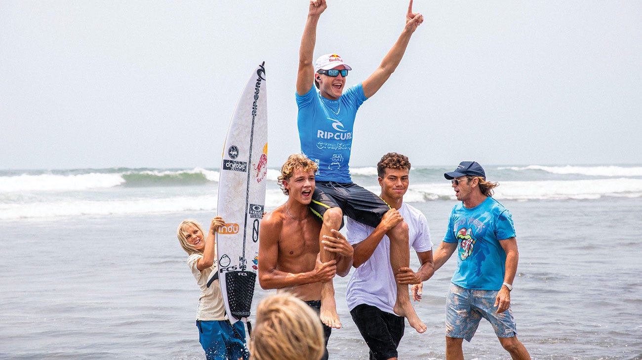 Lukas Skinner being chaired up the beach after his win