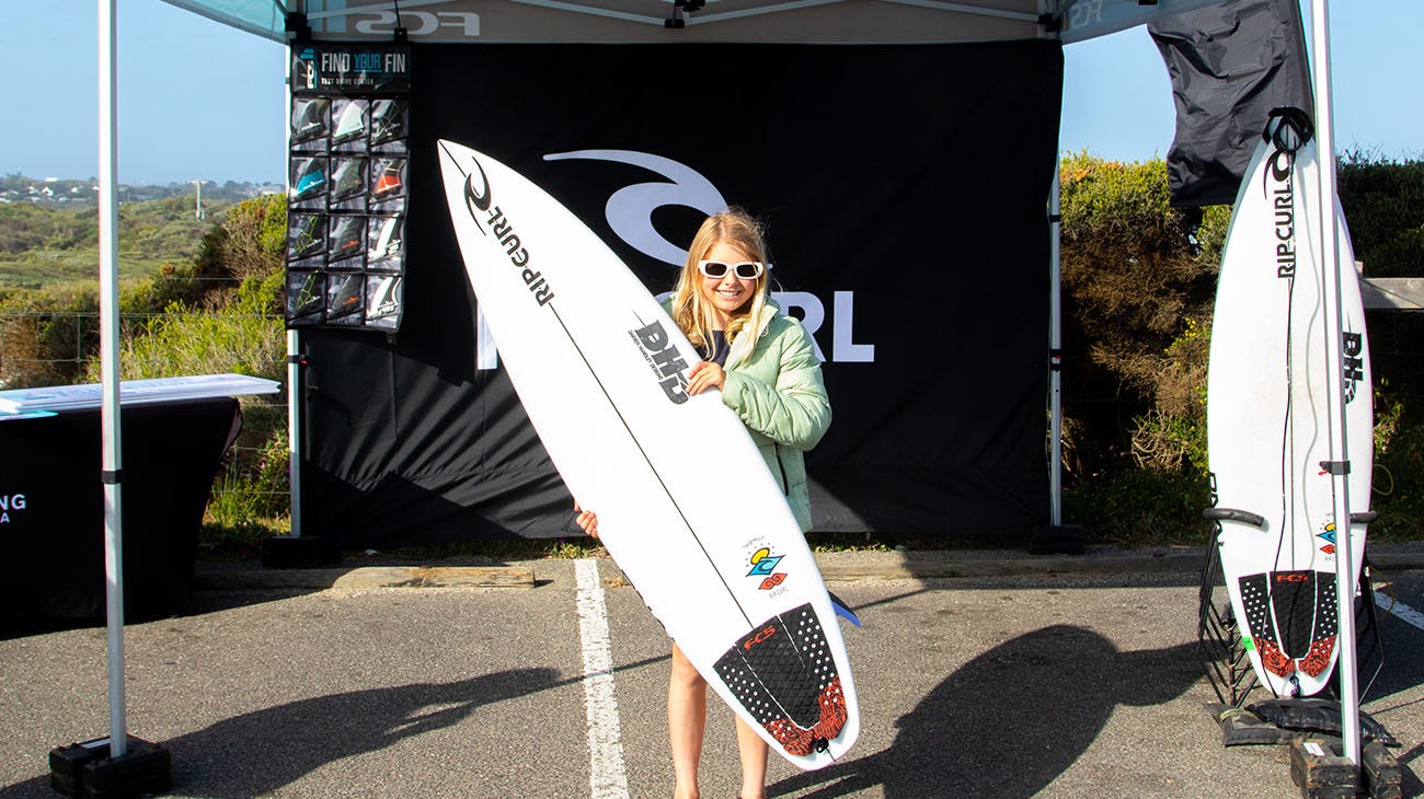 Scarlett Rennie with her new DHD surfboard at the Ultimate GromSearch in Jan Juc