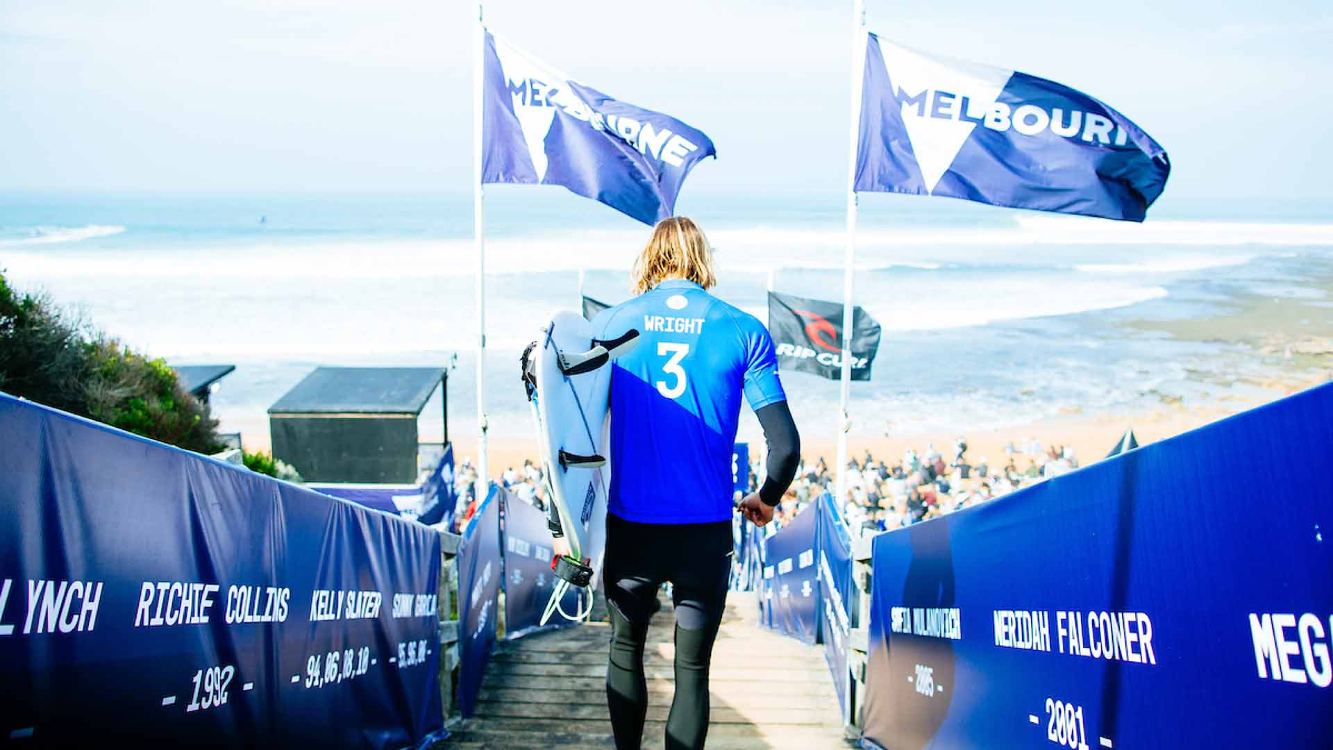 Owen Wright running down the Bells Beach stairs