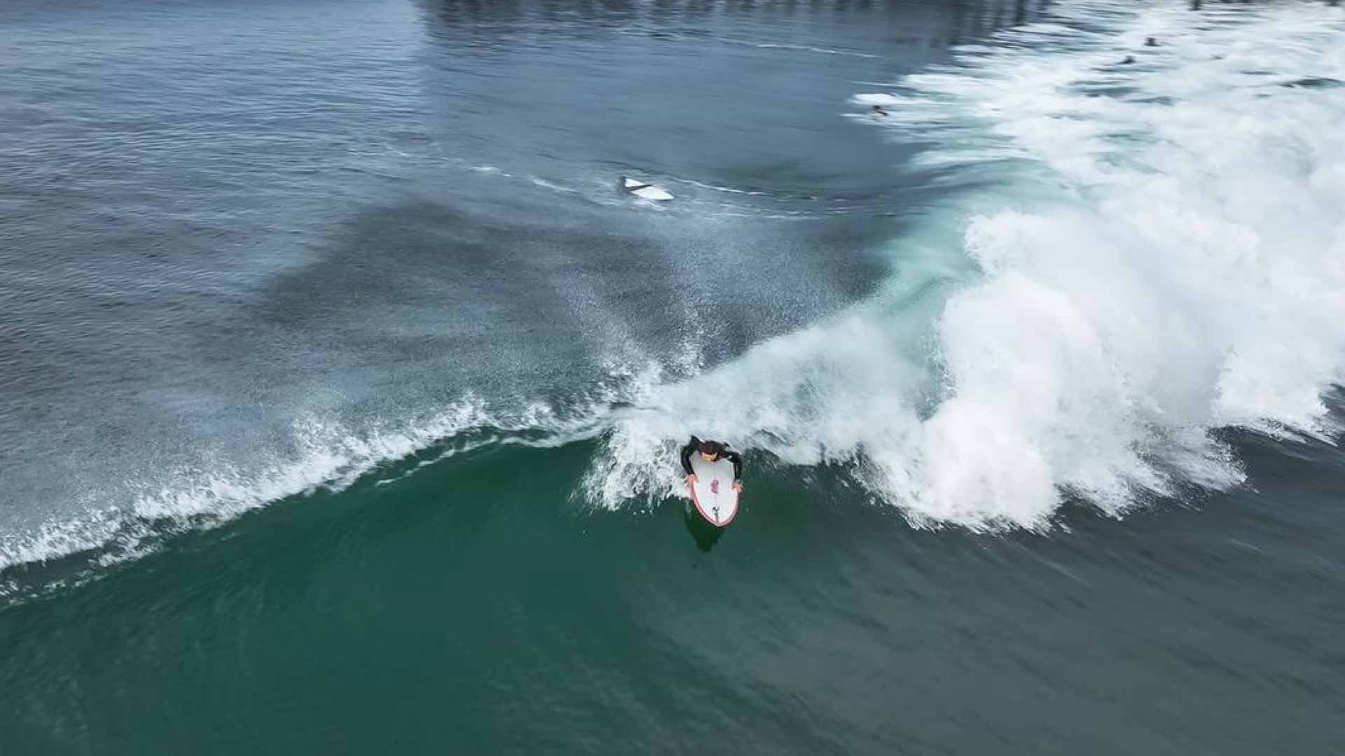 Victoria Feige surfing at the 2022 Pismo Beach ISA World Para Surfing Championship.