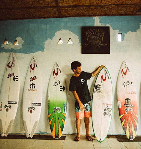 Mason Ho with his Rip Curl surfboards