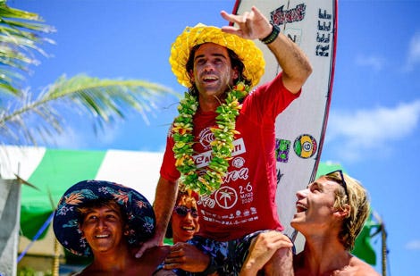 Mason Ho being carried after a win