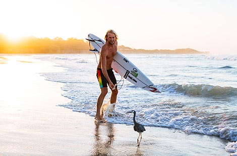 Owen Wright encountering local wildlife on the beach