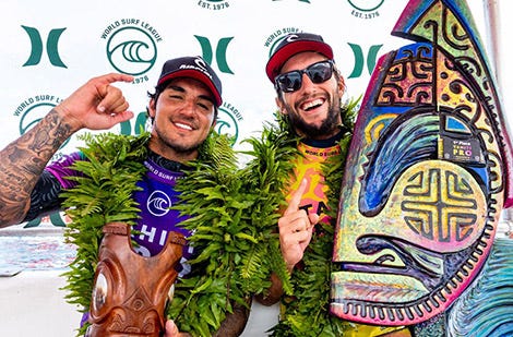 Owen Wright celebrating a win at WSL with Gabriel Medina