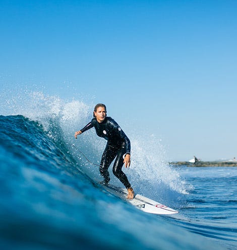 Rosy Hodge surfing for Rip Curl