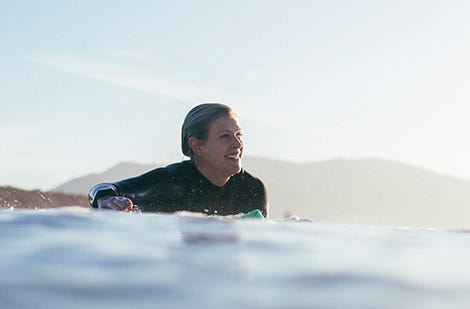 Rosy Hodge surfing for Rip Curl