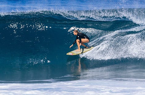 Rosy Hodge surfing for Rip Curl