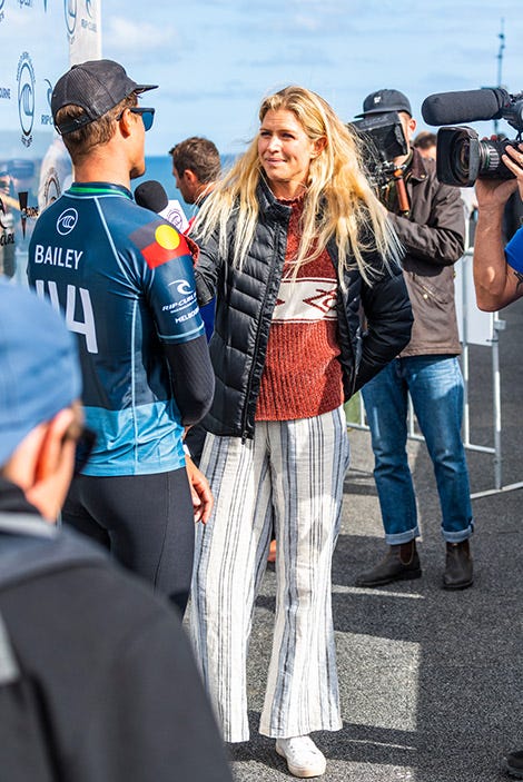 Rosy Hodge interviewing an athlete at the World Surf League event