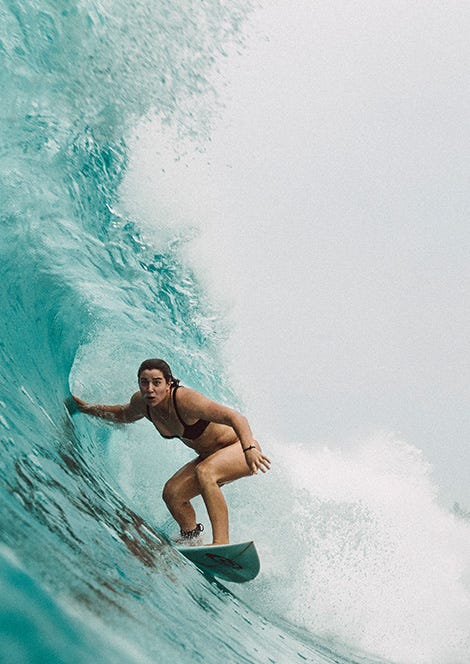 Tyler Wright getting barrelled by a wave