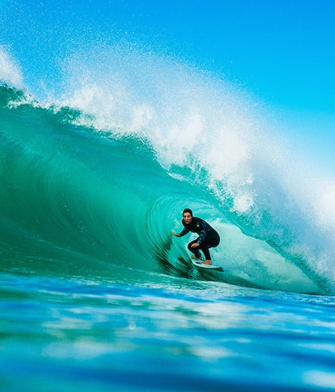 Tyler Wright getting barrelled by a wave