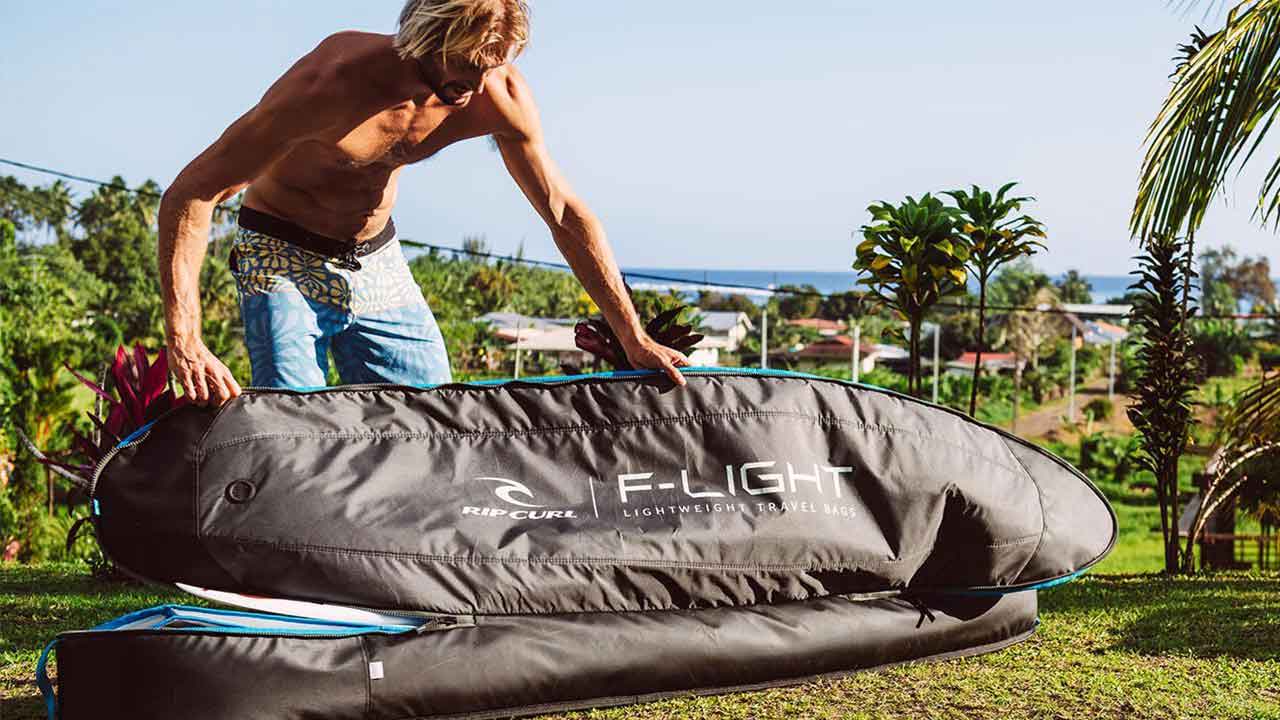 Owen Wright packs his surfboard into a F-Light Travel Bag