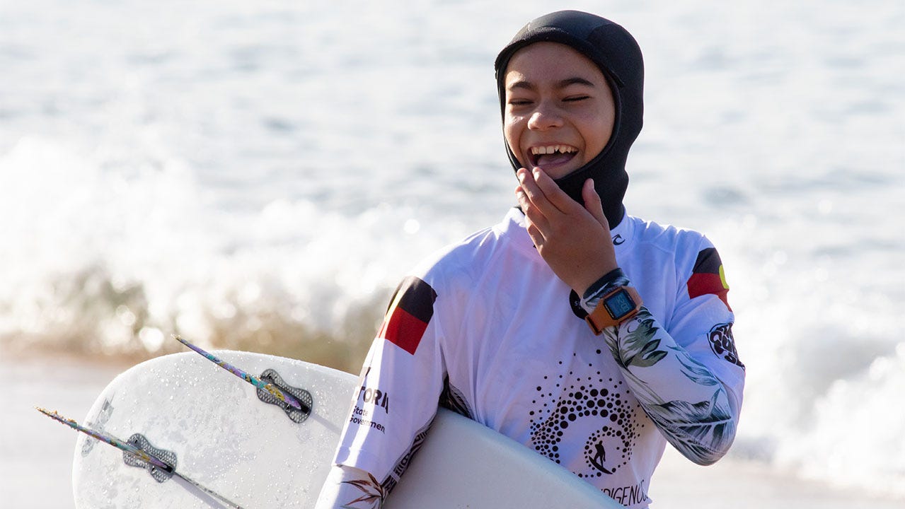 Kauri Heuston-Connor super happy before her surf.