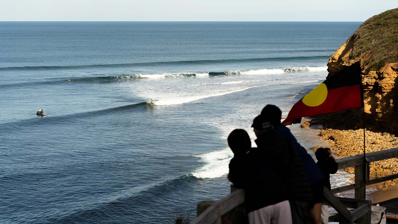 The crowd watching on from the steps of Bells Beach